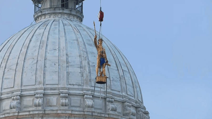 Independent Man is lowered off the RI State House for repairs and restoration